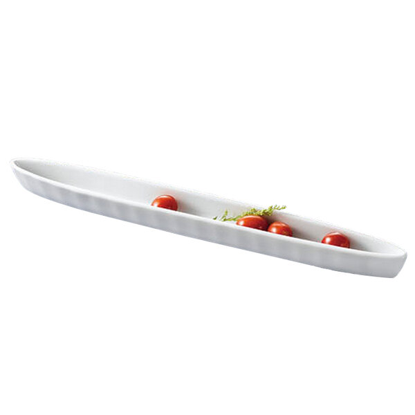 A white rectangular CAC bowl with cherry tomatoes in it.