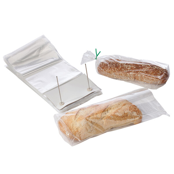 A group of bread in clear plastic bags.