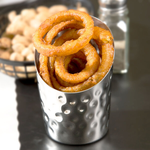 An American Metalcraft stainless steel French fry cup filled with fried onion rings.