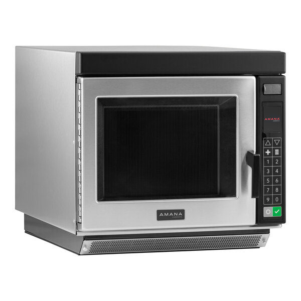 An Amana commercial microwave with a silver and black door.