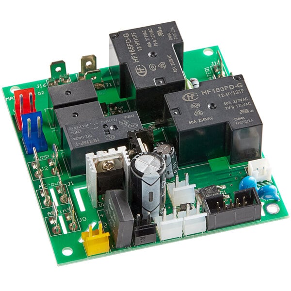A green circuit board with black and white electronic components.