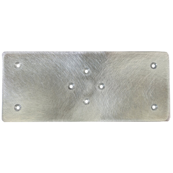 A close-up of a Square Scrub aluminum driver plate with holes in it.