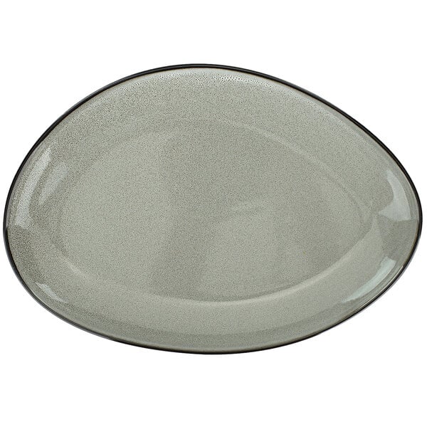 A white oval porcelain platter with a black rim.