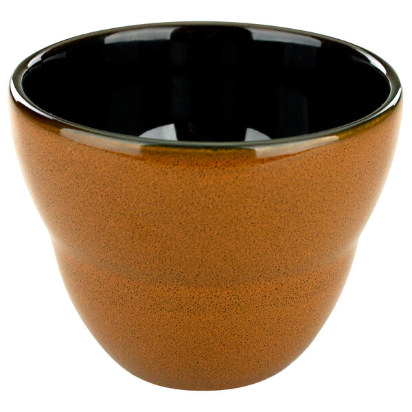 A brown porcelain bowl with a black rim.