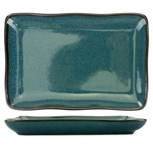 A blue rectangular International Tableware porcelain platter with a black border.