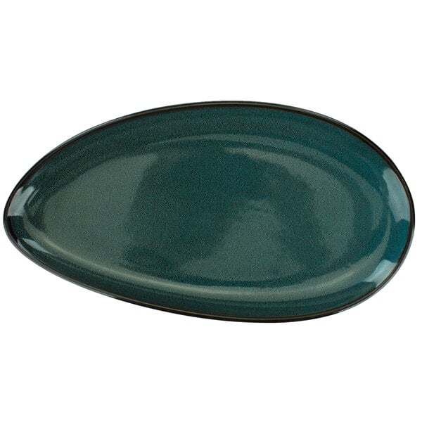 An International Tableware midnight blue oval coupe porcelain platter with a white interior and black rim.