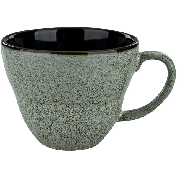 An International Tableware Luna ash porcelain cup with a handle.