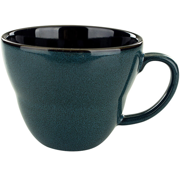 A midnight blue porcelain cup with a handle.