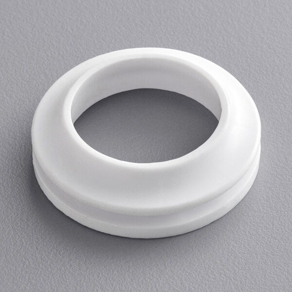 A white circular plastic drip gasket.