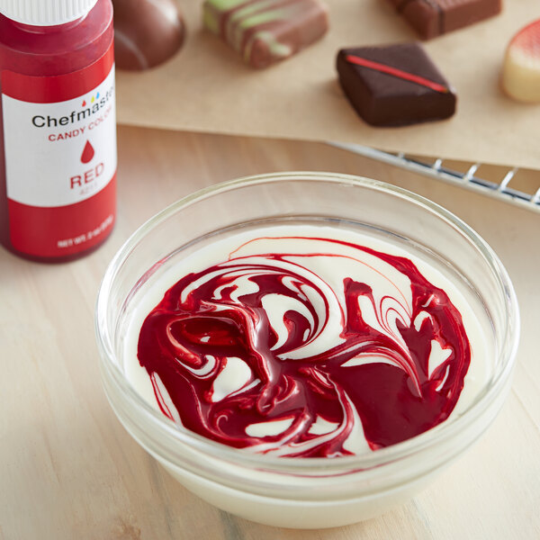 A close-up of a red Chefmaster candy color container.