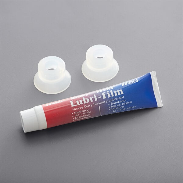 A white tube of lubricant with two plastic caps.