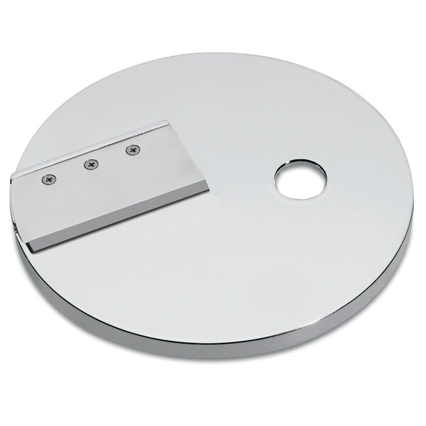 A silver circular disc with holes in it.