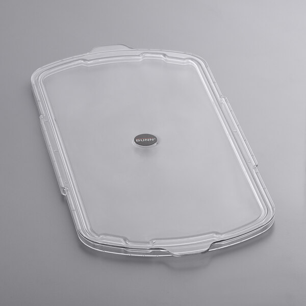 A clear plastic lid with a silver circle on top for a Bunn Granita / Slushy Machine.