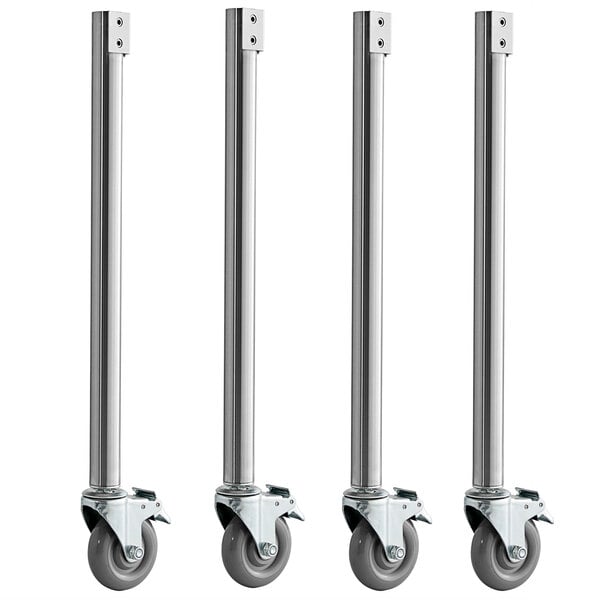 A row of four metal Avantco steam table casters with wheels.
