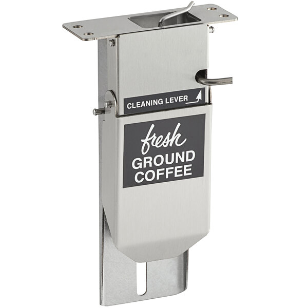 A silver coffee chute with a black label.