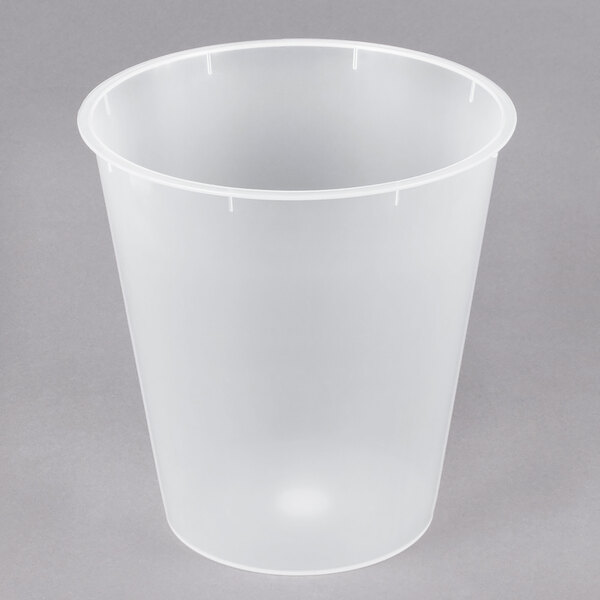 A clear plastic liner for a wastebasket.