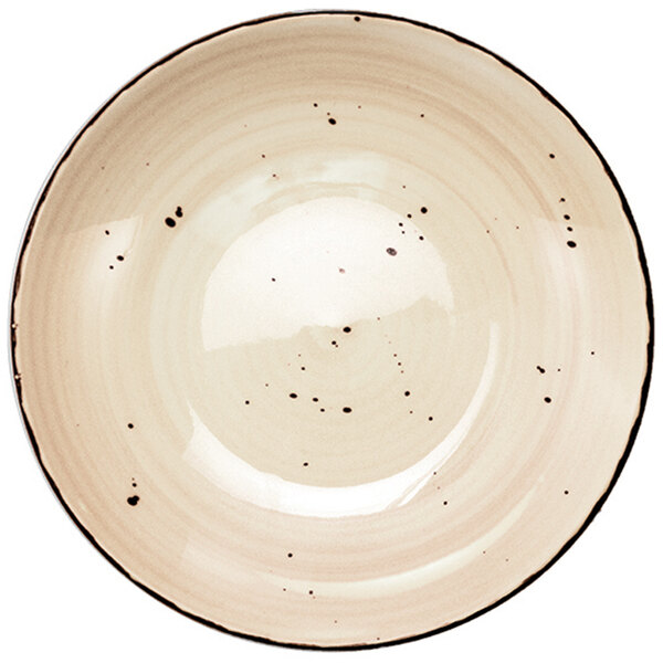 A close-up of a white porcelain pasta bowl with black specks.