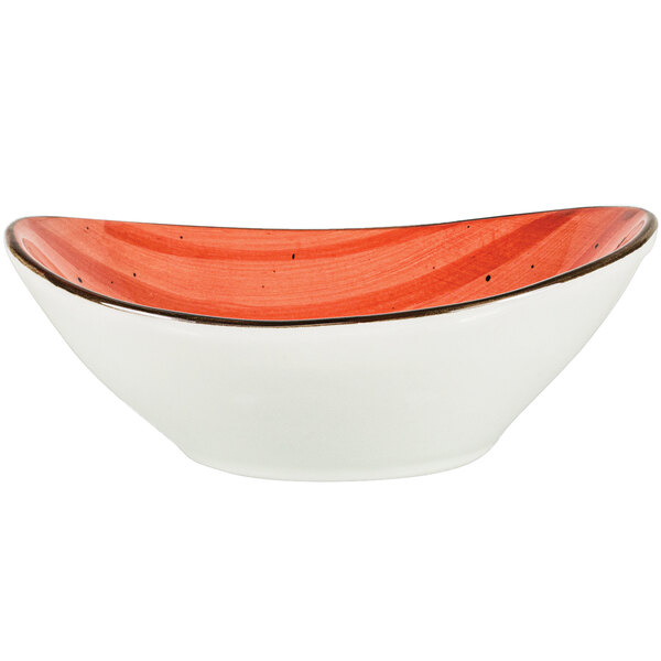An International Tableware Rotana porcelain bowl with a red rim and white base.