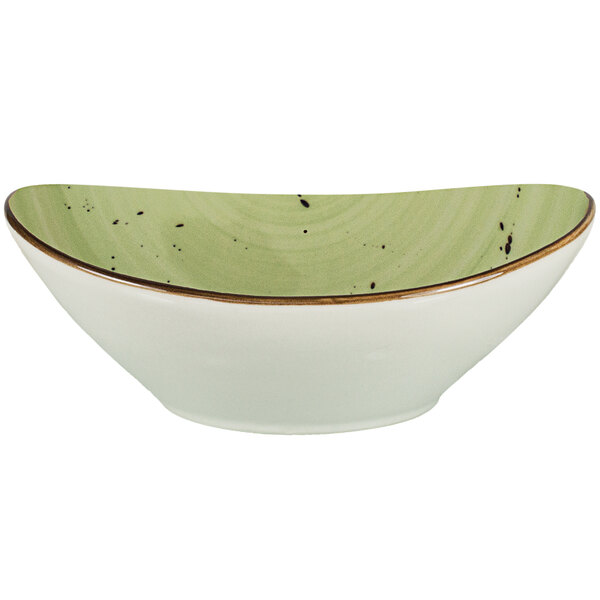 An International Tableware lime green oval porcelain bowl with a green rim.