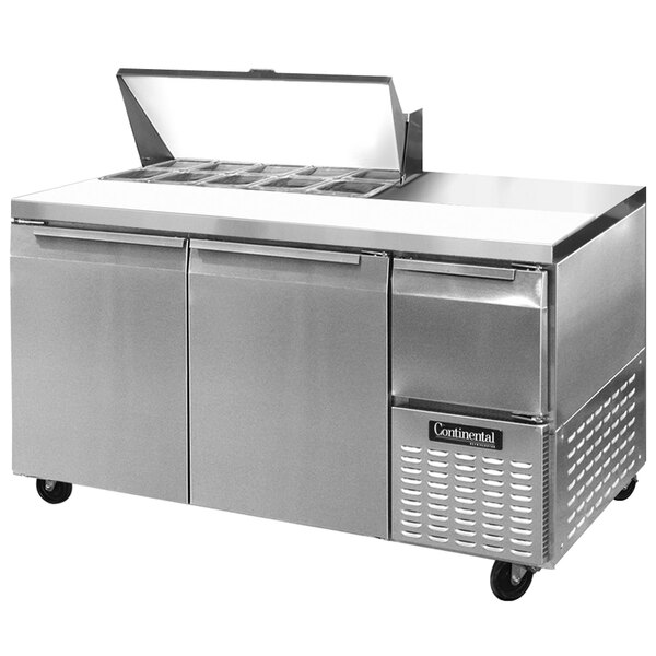 A Continental Refrigerator stainless steel sandwich prep table with 2 doors open on top of a counter.