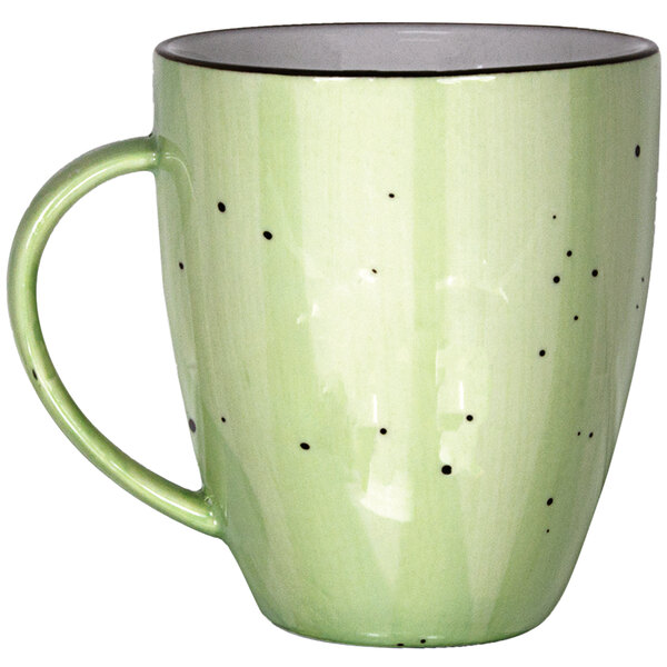 An International Tableware lime green porcelain cup with black dots.