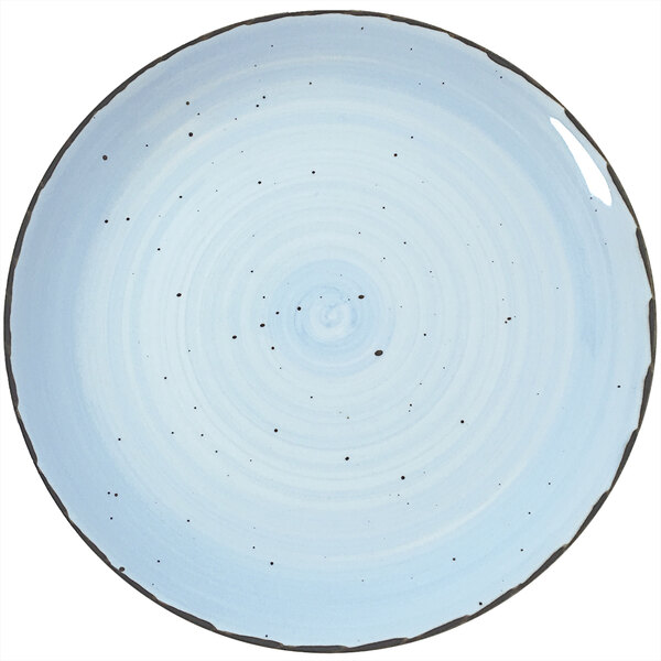 A close up of a blue and white speckled International Tableware Rotana Iceburg coupe porcelain plate.