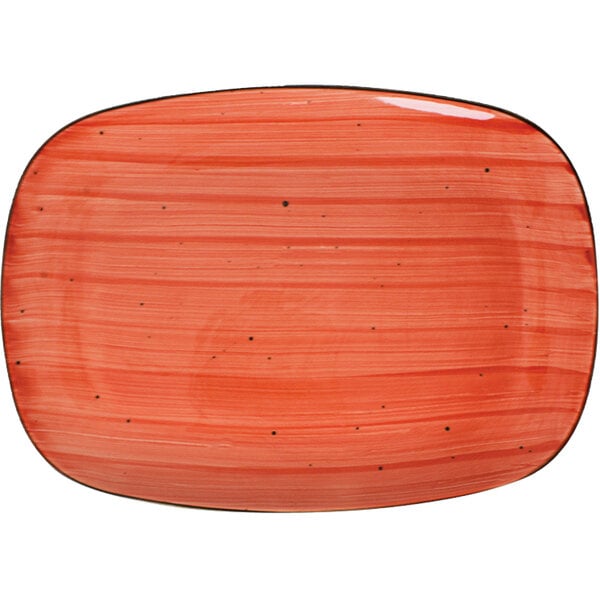 A ruby rectangular porcelain platter with black dots.