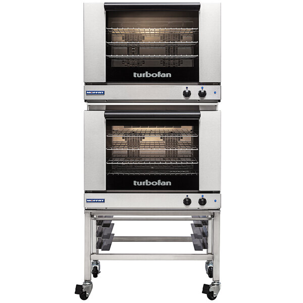 A Moffat Turbofan Double Deck Electric Convection Oven on wheels with shelves.