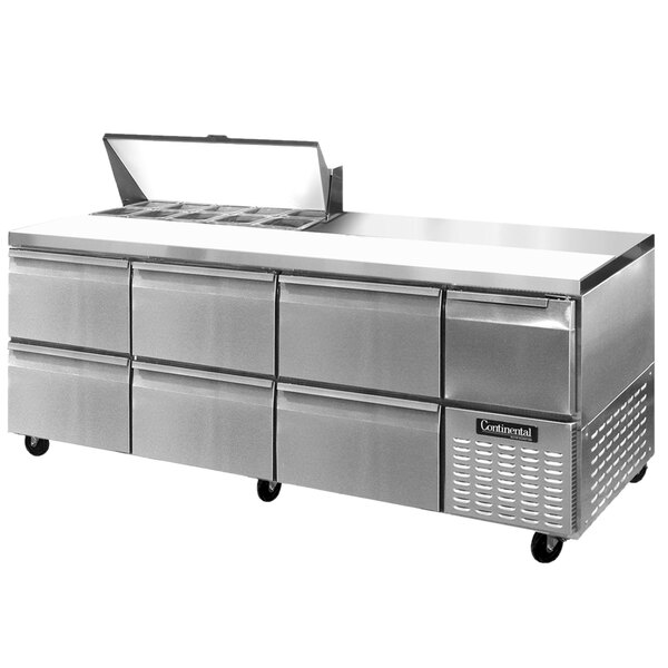 A stainless steel commercial sandwich prep table with drawers.