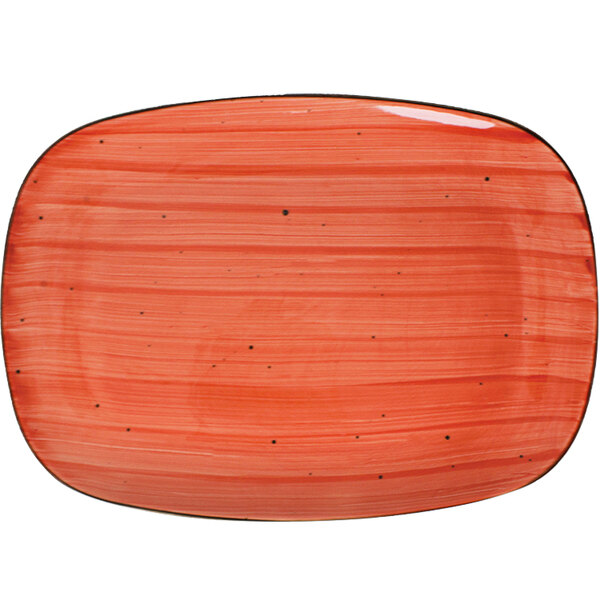 A red rectangular porcelain platter with black speckles.