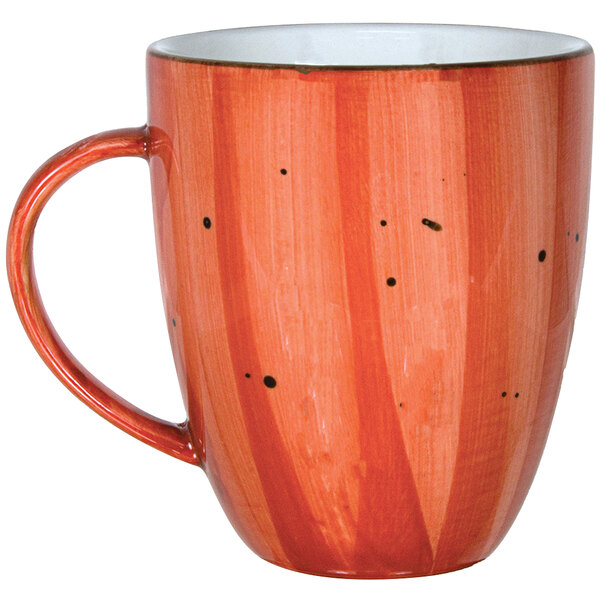 A ruby porcelain cup with a wooden handle.