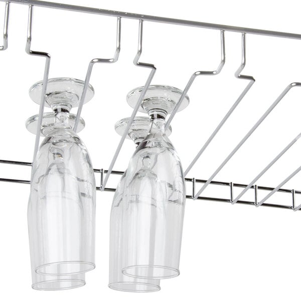 A Regency chrome wire rack holding wine glasses.
