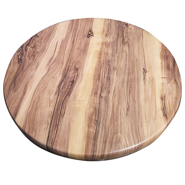 An American Tables & Seating round Indian Rosewood Isotop table top on a wood table.
