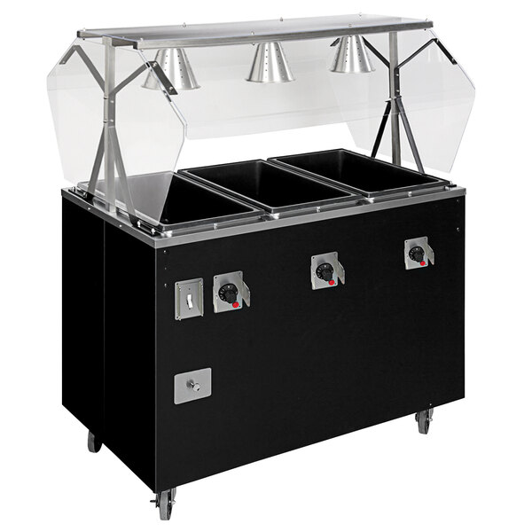 A black Vollrath hot food station with enclosed storage and clear covers on a counter.
