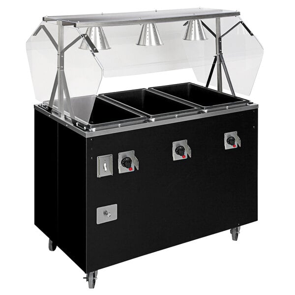 A black food warmer with a clear cover on a black counter.