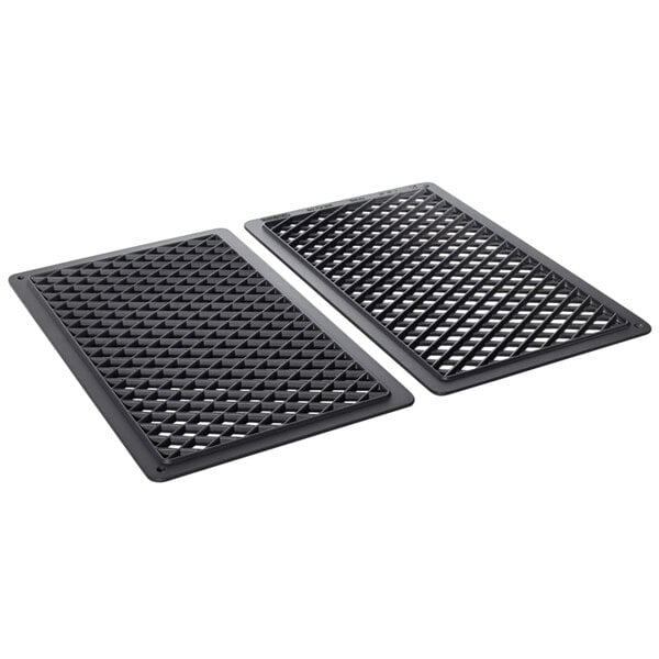 Two black metal grill grates with cross and stripe patterns.