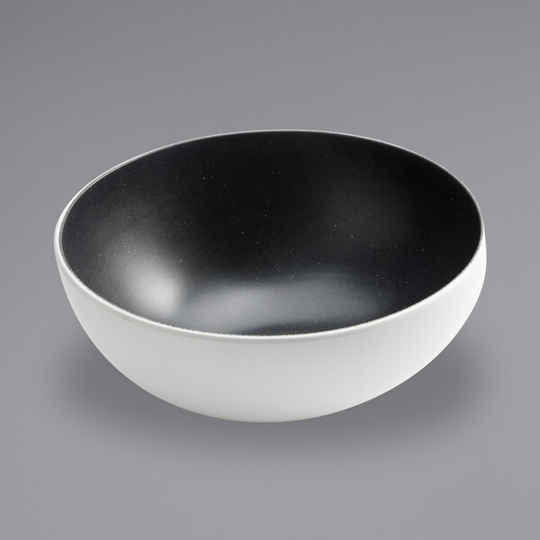 An American Metalcraft white melamine bowl with a black speckled rim.