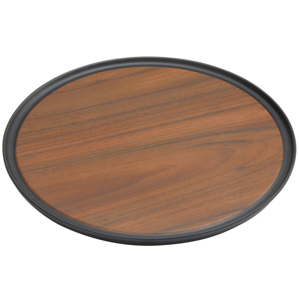 An American Metalcraft round wood serving tray with a black rim.