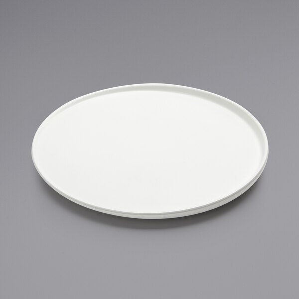 An American Metalcraft white melamine plate with a circular rim.