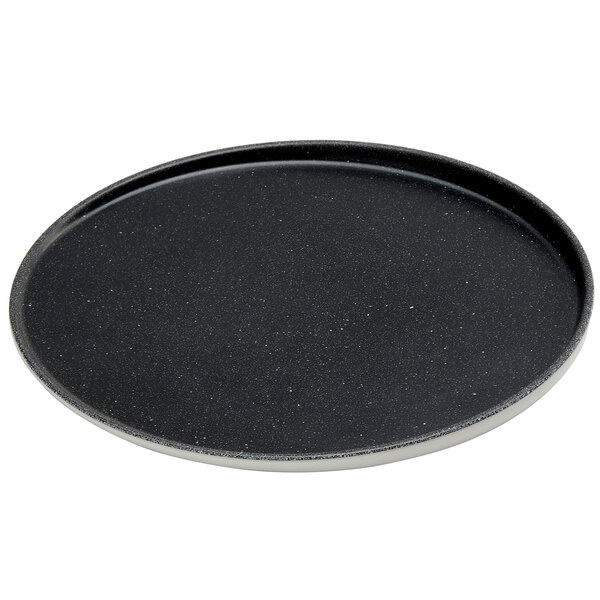 An American Metalcraft speckled black and white melamine plate with a black rim.