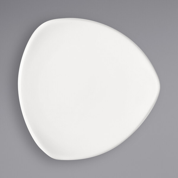A bright white Bauscher porcelain plate with a circular design on it.