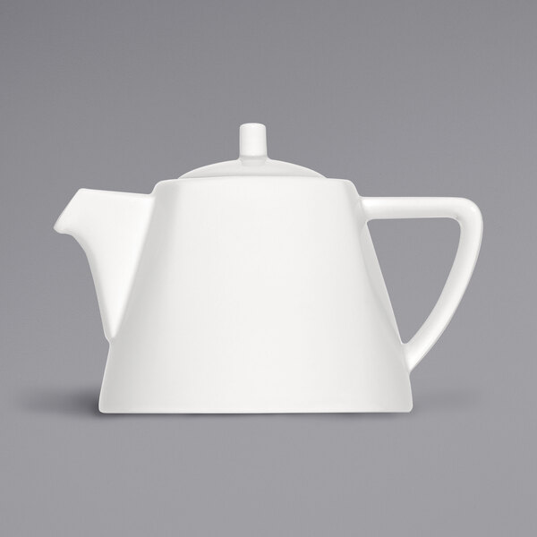 A close up of a white Bauscher porcelain teapot with a cylindrical lid.