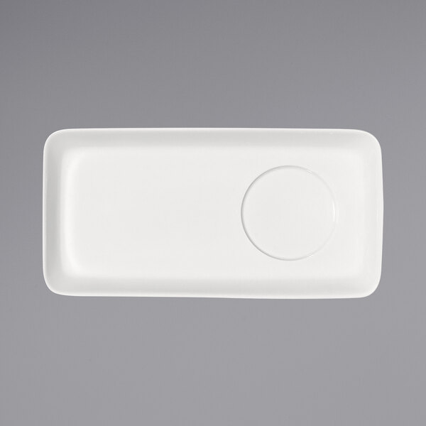 A white rectangular porcelain platter with a raised circle in the middle.