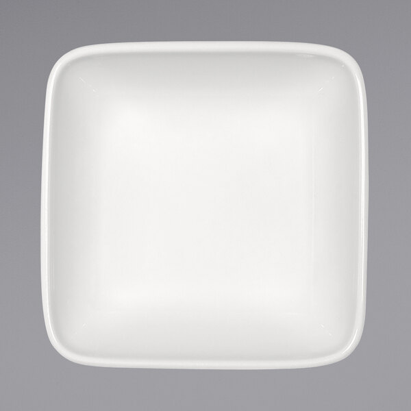 A Bauscher bright white square porcelain bowl with a small rim.