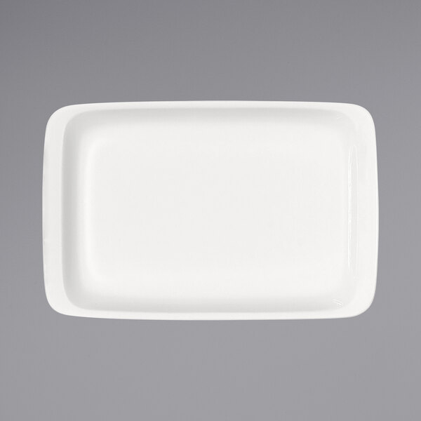 A white rectangular porcelain platter with a raised rim.