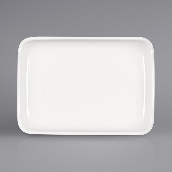A white rectangular porcelain platter with a raised white rim.