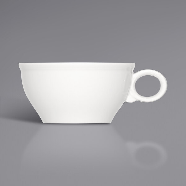 A close up of a Bauscher bright white porcelain cup with a handle.