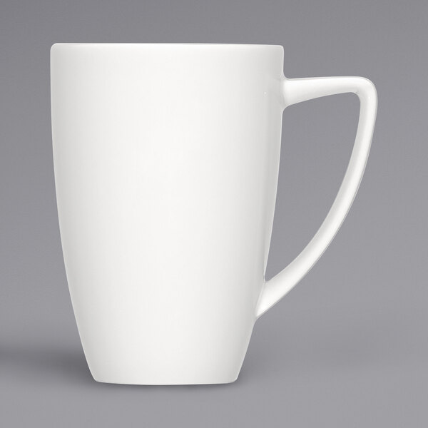 A close-up of a Bauscher bright white porcelain mug with a handle.