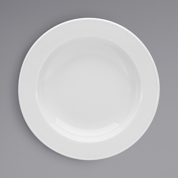 A close-up of a Bauscher bright white porcelain deep plate with a wide rim.