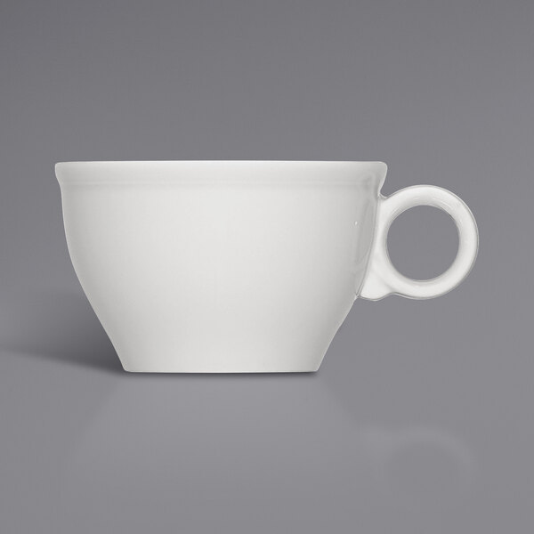 A close-up of a Bauscher bright white porcelain cup with a handle.
